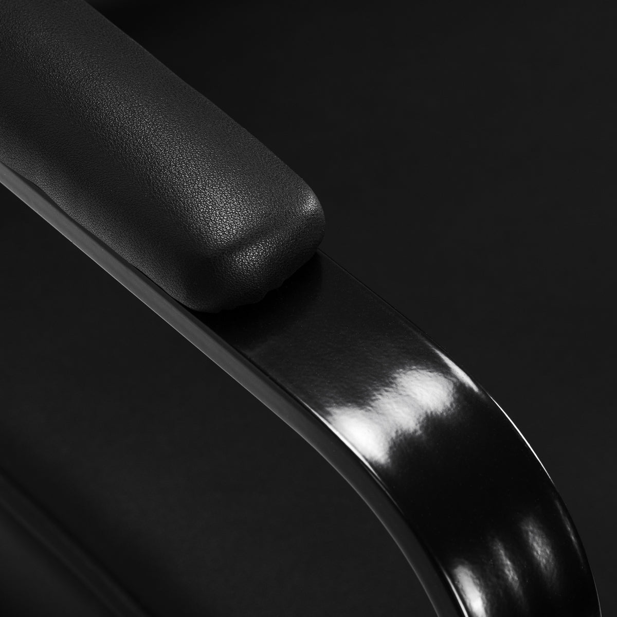 Black Hairdressing Chair by HAIR SYSTEM, Studio Noir model, with cushioned seat and adjustable height for salon styling.