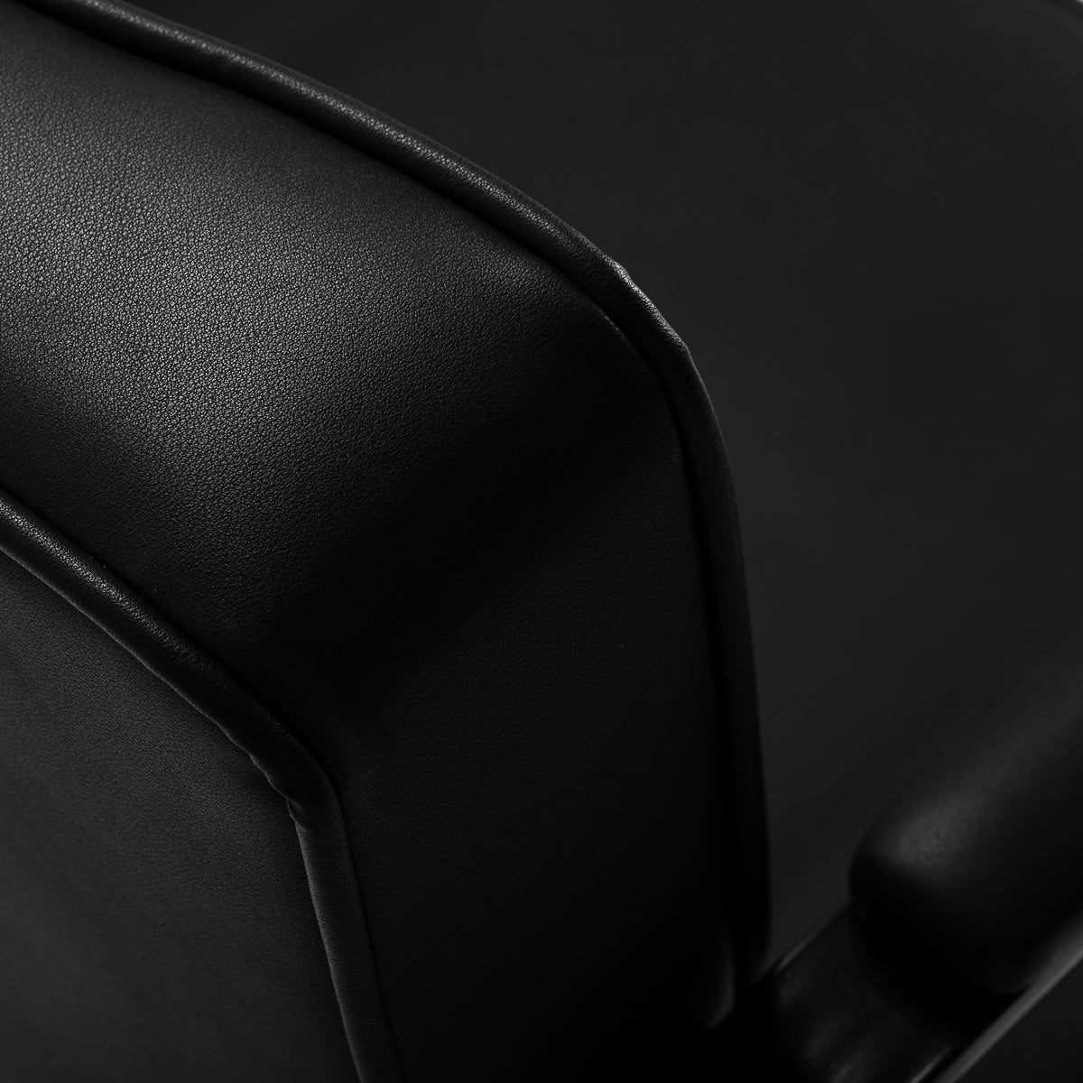 Black Hair System hairdressing chair with sleek design and adjustable features, ideal for salon styling and hairdressing services.