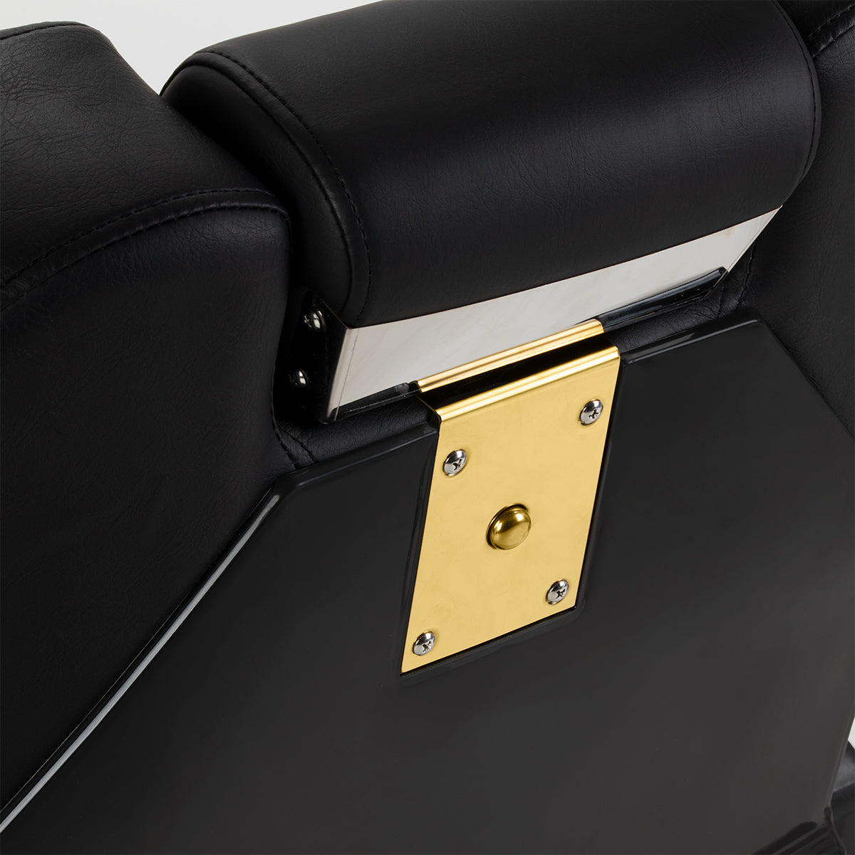Black and gold HAIR SYSTEM barber chair with padded seat, armrests, and adjustable height for professional barbershop use.