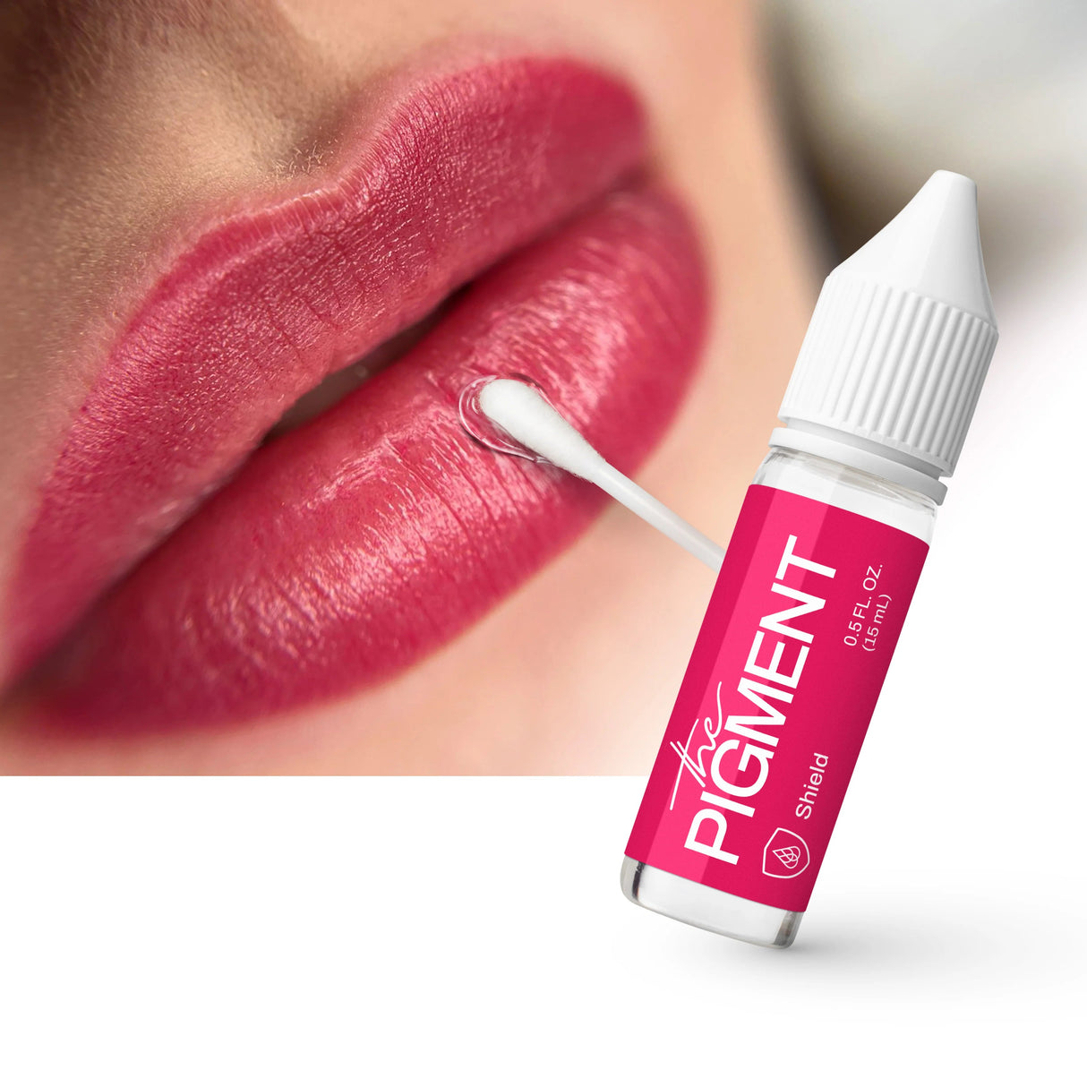 Close-up of The Pigment Shield 15ml bottle with label, showcasing clear packaging and product name.
