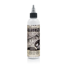 Nocturnal Shine White Legacy — buteliukas baltame fone, produktų šeimos pakuotės pavyzdys