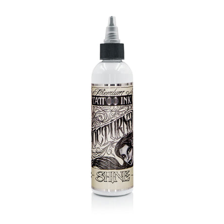 Nocturnal Shine White Legacy — buteliukas baltame fone, produktų šeimos pakuotės pavyzdys