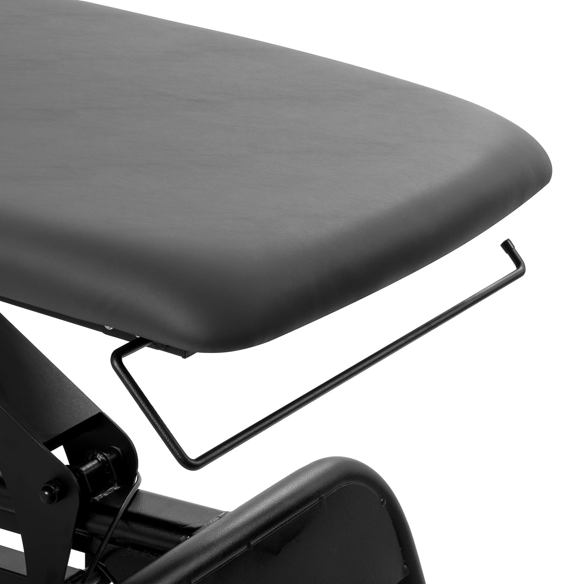 Towel and accessory holder near the foot section of massage table