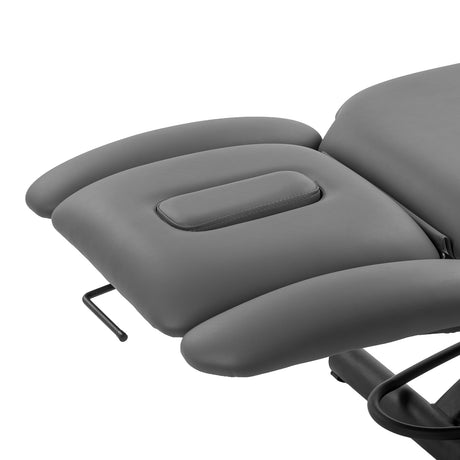 Grey massage table with face opening and removable cushion