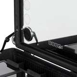 Black makeup table case with fold-out tiered organiser