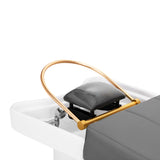 Gabbiano Head Spa 017 grey hair washing bed with cushioned headrest and adjustable armrests in a spa setting