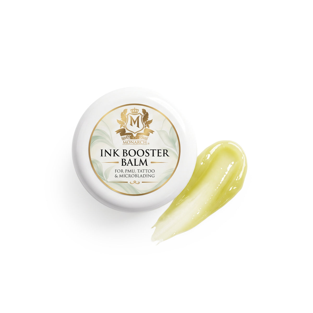 Skin Monarch Ink Booster Balm 30ml, dangtelis šalia blizgaus geltono balzamo potėpio