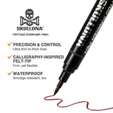 Skull DNA dual-ended skin marker in red and blue ink with skull-themed design, ideal for body art and temporary tattoos.