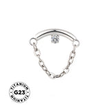 Titano žiedas su grandinėle kabančiu papuošalu